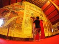 Visitor taking picture of the famous mural painting of the northern THAILAND WAT PHUMIN Royalty Free Stock Photo
