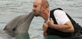 A Visitor to Dolphinaris, Arizona, Gets a Dolphin Kiss Royalty Free Stock Photo