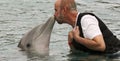 A Visitor to Dolphinaris, Arizona, Gets a Dolphin Kiss Royalty Free Stock Photo