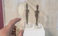 Visitor touching replica made with 3d printer, Huelva, Spain