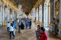 Visitors admiring the Hall of Mirrors Palace Versailles near Paris, France