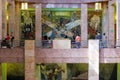 Visitors admiring the murals at the Palacio de Bellas Artes in Mexico City