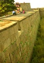 Visitors on the big fort battlement and large wall at vellore fort