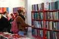 Visitors at book fair wearing mandatory face mask