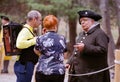 Visitors chat with colonial period soldier