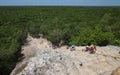 Visitors climb an ancient pyramid at the Coba archaeological site Royalty Free Stock Photo