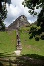 Visitors climbing stairs to Maya ruin \'El Castillo\' at Xunantunich near San Ignacio, Belize