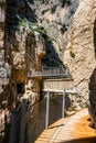 Visitors crossing the suspension bridge at Gaitanes Gorge, Malaga, Spain