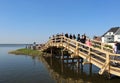 Visitors crossing wooden bridge in Steinhude Meer,Germany