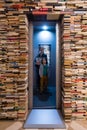Visitors in elevator made of books at the City Gallery of Bratislava, Slovakia