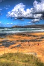 Visitors enjoying Constantine Bay Cornwall England UK on the Cornish north coast near Newquay stunning colourful HDR Royalty Free Stock Photo