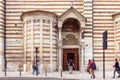 Visitors enter the Duomo Cattedrale di S. Maria Matricolare cathedral through the side entrance in Verona, Italy Royalty Free Stock Photo