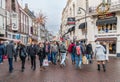 Visitors entering and leaving the main shopping street in the old town