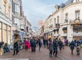 Visitors entering and leaving the main shopping street in the old town