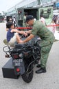 Visitors exploring the Yamaha Tw200 motorcycle at Army Open House 2017 in Singapore.