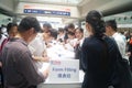 Visitors fill out personal information into the exhibition hall Royalty Free Stock Photo