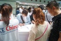 Visitors fill out personal information into the exhibition hall Royalty Free Stock Photo