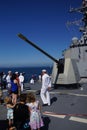 Visitors in front of 5 inch gun