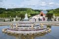 Visitors in garden Palace Versailles with statue and pond at Paris, France Royalty Free Stock Photo