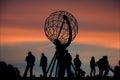 Visitors at globe sculpture at north cape in norway