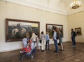 Visitors in the hall of the famous Russian artist Viktor Vasnetsov at his painting `The Knight at the Crossroads`