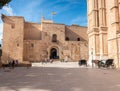 Visitors and horse-drawn carriage at cathedral in Palma