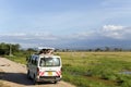 Visitors on jeep shoot near Mount Kilimanjaro