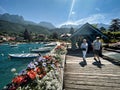 visitors of lake annecy on boardwalk talloires Royalty Free Stock Photo