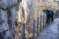 Visitors leaning out the footbridge along Caminito del Rey path