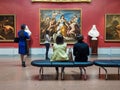 Visitors looking at artworks in Pushkin State Museum of Fine Art