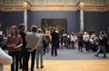 Visitors looking at the famous The Night Watch by Rembrandt, Amsterdam Royalty Free Stock Photo