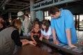 Visitors looking at tide pool exhibit at Montery Bay Aquarium