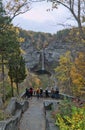 Visitors looking at waterfall, Taughannock Falls, tourist destination in Finger Lakes, New York. Travel, tourism in autumn.