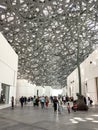 Visitors at The Louvre, Abu Dhabi designed by architect Jean Nouvel. Royalty Free Stock Photo