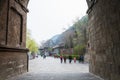 Visitors near gate to Longmen Caves in spring