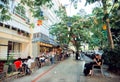 Visitors of outdoor cafe have breakfast