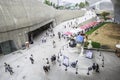 Visitors outside Dongdaemun Design Plaza, Seoul, South Korea