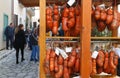 Visitors pass next to traditional `Sobrasada` typÃÂ¬cal MallorcaÃÂ´s sausages seen on local rural market in the island of Mallorca
