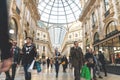 Visitors passing by iat Gelleria Vittorio Emanuelle II in Milan, Italy