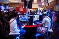 Visitors Playing Video Games at Indo Game Show 2013 Royalty Free Stock Photo