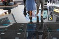 Visitors on reflecting floor at Autosalon Genf 2019 in Geneva, Switzerland