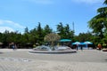 Visitors relax at Mount Mtatsminda Park fountain courtyard with Radio Tower and stall Tbilisi Georgia Royalty Free Stock Photo