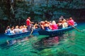 Visitors in Small Row Boats, Melissani Underground Cave Lak, Kefalonia, Greece