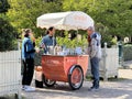 Visitors stop by ice cream cart in the Palais Royal garden, Paris.