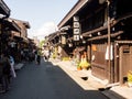 Visitors strolling in the historic Sannomachi district of Takayama, Japan