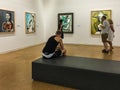 Visitors study Picasso paintings at the Centre Pompidou in Paris