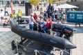 Visitors survey army troop inflatable boats at the army exhibition `Our IDF`