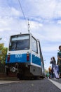 Visitors to the exhibition of retro trams photograph an old carriage of the Moscow tram of the KTM 8 series