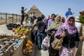 Visitors to Giza gather near the base of the Pyramid of Khafre in Cairo, Egypt.