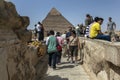 Visitors to Giza view the Pyramid of Khufu in Cairo, Egypt.